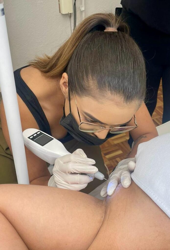 Shiroy professional aesthetician performing skin lesion treatment